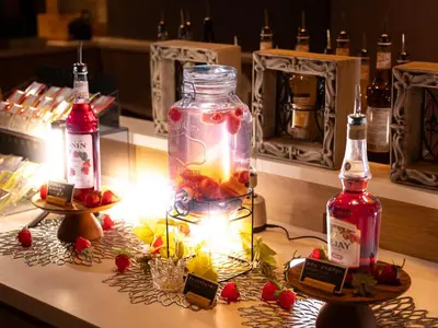 a table with a jar of fruit and a candle at SUPER HOTEL Ikebukuro West Natural Hot Spring in Tokyo