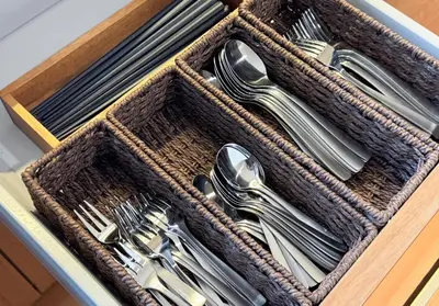 a drawer filled with cutlery in a wooden box at Higashi-Shinjuku 1002 in Tokyo