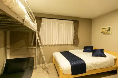 a bedroom with a bunk bed next to a window at \u85cd-Ai-ASAKUSA in Tokyo