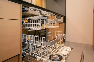 a dishwasher with dishes in it in a kitchen at \u85cd-Ai-ASAKUSA in Tokyo
