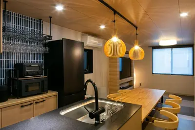 a kitchen with a sink and a counter top at \u85cd-Ai-ASAKUSA in Tokyo