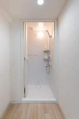 a white bathroom with a shower in a room at -Higashi Shinjuku 1009- in Tokyo