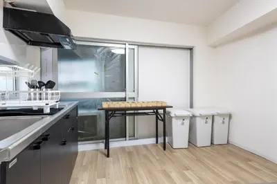 a kitchen with a table in the middle of it at -Higashi Shinjuku 1009- in Tokyo