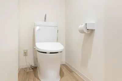 a bathroom with a white toilet in a room at Higashi-Shinjuku 1012 in Tokyo