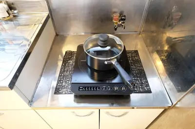 a pot on top of a stove in a kitchen at Yoyogi Flats - Vacation STAY 18018 in Tokyo