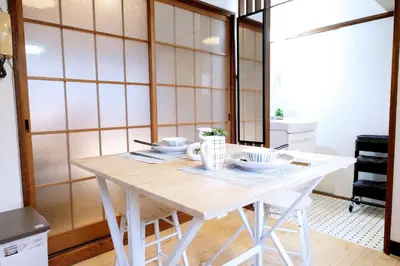 a white table with bowls on it in a room at Yoyogi Flats - Vacation STAY 18018 in Tokyo