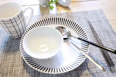 a plate with a cup and a spoon on a table at Yoyogi Flats - Vacation STAY 18018 in Tokyo