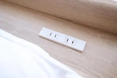 a white lightswitch on a wall next to a bed at Yoyogi Flats - Vacation STAY 18018 in Tokyo