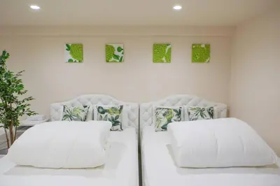 two white pillows on a bed in a room at SLEEPLAB THE STAY Casual \u65b0\u5bbf2 in Tokyo