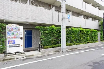 a building with a sign on the side of a street at SLEEPLAB THE STAY Casual \u65b0\u5bbf2 in Tokyo