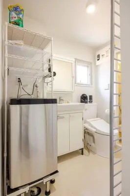 a kitchen with a refrigerator and a sink at \u30a2\u30f3\u30c9\u30b9\u30c6\u30a4\u767d\u91d16\u4e01\u76ee301 in Tokyo