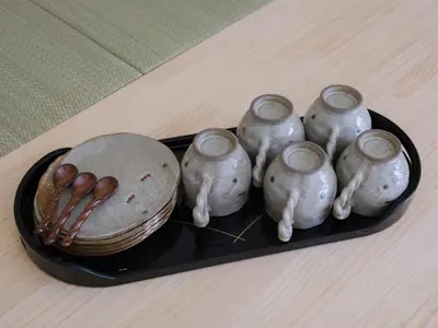 a tray with a group of vases and a bowl at HOTEL Kyo in Tokyo