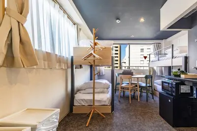 a room with a loft bed and a dining room at Harebare apartment for max 4ppl 3mins walk from Kiba station 4F in Tokyo