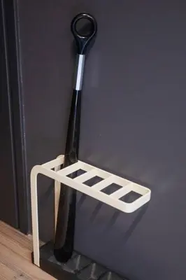 a black baseball bat hanging on a wall at Harebare apartment for max 4ppl 3mins walk from Kiba station 4F in Tokyo
