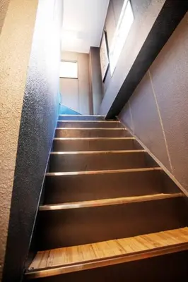 a set of stairs in a building at Harebare apartment for max 4ppl 3mins walk from Kiba station 5F in Tokyo