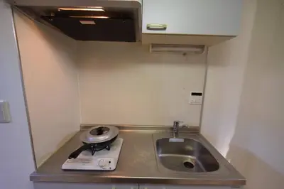 a small kitchen with a sink and a counter at \u6587\u4eac\u533a\u8c4a\u5cf6\u533a\u5357\u5927\u585a1 in Tokyo