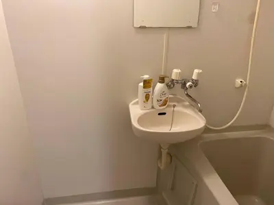 a white bathroom with a sink and a bath tub at \u6587\u4eac\u533a\u8c4a\u5cf6\u533a\u5357\u5927\u585a1 in Tokyo