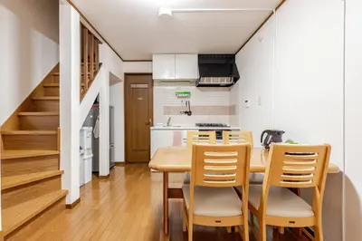 a kitchen and dining room with a table and chairs at kensui house in Tokyo
