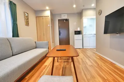 a living room with a couch and a table at ZJ201 Hanama201 The Skytree Residence A Newly Home by Tokyo Iconic Landmarks in Tokyo