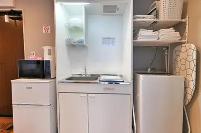 a small kitchen with a sink and a refrigerator at ZJ201 Hanama201 The Skytree Residence A Newly Home by Tokyo Iconic Landmarks in Tokyo