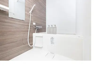 a white bathroom with a shower with a sink at \u3077\u3075\u304bTK\u6771\u5411\u5cf62F - 1min to Higashi Mukojima Sta 2F Cozy Stay Near Skytree Asakusa in Tokyo