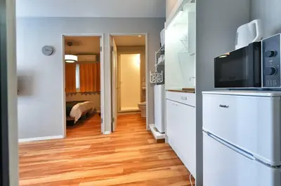 a room with a kitchen with a television and a refrigerator at ZJ202 Hanama202 The Skytree Residence A Newly Home by Tokyo Iconic Landmarks in Tokyo