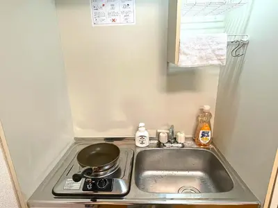 a kitchen sink with a pot on a stove at japanese art kiyo-e house traditional towns self check in in Tokyo