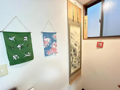 a white wall with pictures of dogs on it at japanese art kiyo-e house traditional towns self check in in Tokyo