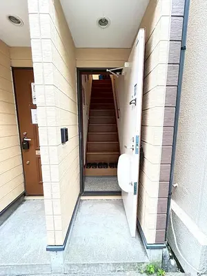 a hallway of a building with a door and stairs at japanese art kiyo-e house traditional towns self check in in Tokyo