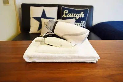 a white hair dryer sitting on top of a table at #6 -\u30a8\u30af\u30bb\u30eb\u6a4b\u7acb203- Entire Unit in Tokyo