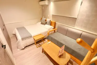 a small room with a bed and a couch at Metro 4 min to Shinjuku St Luxury Home in Shinjuku City in Tokyo