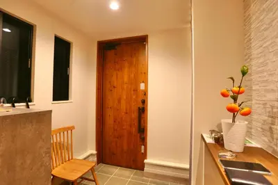 a kitchen with a sink and a wooden door at Metro 4 min to Shinjuku St Luxury Home in Shinjuku City in Tokyo
