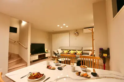 a living room with a table and a couch at Metro 4 min to Shinjuku St Luxury Home in Shinjuku City in Tokyo