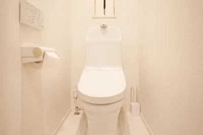 a bathroom with a white toilet in a stall at Mi-Villa SOMO in Tokyo