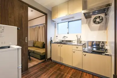 a kitchen with a sink and a counter top at Mi-APT TAKINO in Tokyo