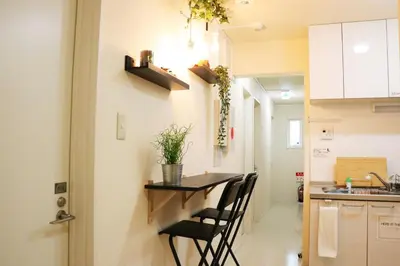 a kitchen with a table and chairs in a room at OHANA TOKYO HOUSE - Vacation STAY 67721v in Tokyo