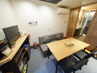 a small living room with a table and a couch at Accommodation Kisakata - Vacation STAY 63868v in Tokyo