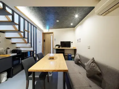 a living room with a couch and a wooden table at Accommodation Kisakata - Vacation STAY 63868v in Tokyo