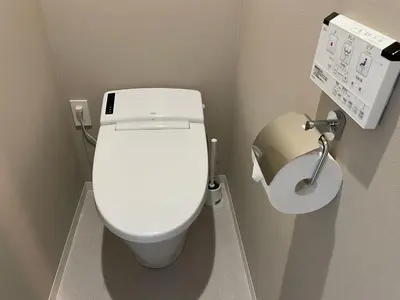 a bathroom with a white toilet and a sink at COMMA HOUSE Shinjuku 14 in Tokyo