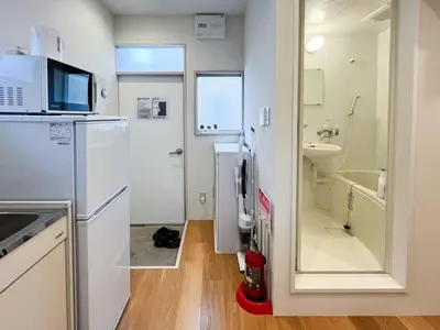 a small bathroom with a sink and a toilet at \u30a2\u30f3\u30c9\u30b9\u30c6\u30a4\u8db3\u7acb2\u4e01\u76ee202 Soi house in Tokyo