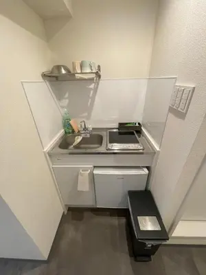 a small kitchen with a sink and a stove at shinjuku yuki okubo 502-SJ0044 in Tokyo