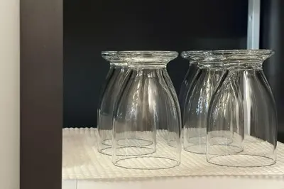 three clear glass vases sitting on a shelf at shibuya sakaraku-SY0027 in Tokyo