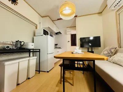 a kitchen with a couch and a table in a room at shibuya sakaraku-SY0027 in Tokyo
