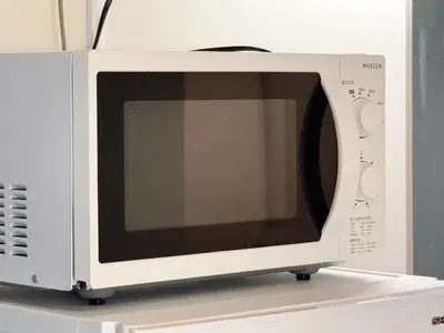 a white microwave oven sitting on top of a counter at shibuya sakaraku-SY0027 in Tokyo