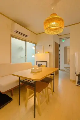a dining room with a table and a couch at shibuya sakaraku-SY0027 in Tokyo
