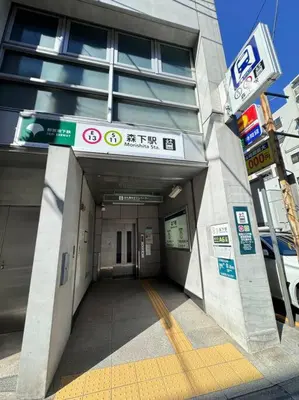 a hallway leading to a building with signs on it at \u68ee\u4e0b\u99c52\u5206\u4e21\u56fd\u99c57\u5206Skytreeview401 in Tokyo