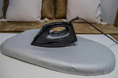 a black computer mouse sitting on a pillow on a bed at #8 -\u30a2\u30a4\u30e0\u30bf\u30a6\u30f3\u5357\u845b\u897f- Entire Unit in Tokyo