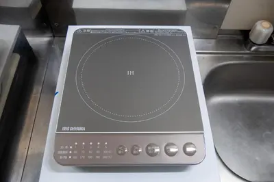 an electronic device sitting on a counter next to a sink at #8 -\u30a2\u30a4\u30e0\u30bf\u30a6\u30f3\u5357\u845b\u897f- Entire Unit in Tokyo