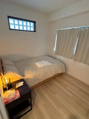 a small bedroom with a bed and a table at \u68ee\u4e0b\u99c52\u5206 sky tree view 501 in Tokyo