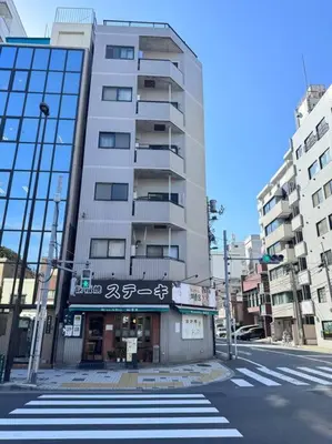 a tall building on the corner of a city street at \u68ee\u4e0b\u99c52\u5206 sky tree view 501 in Tokyo